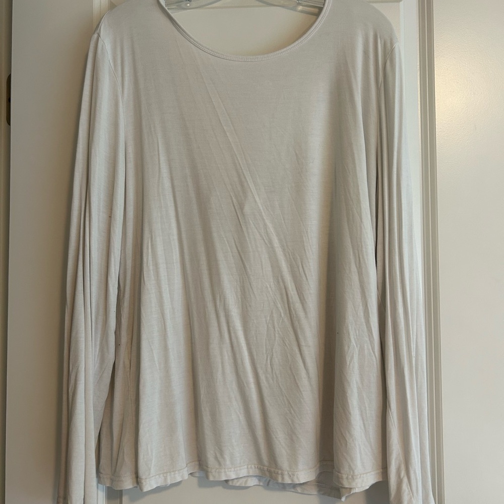 Soft flowy white long sleeve with cut out on back